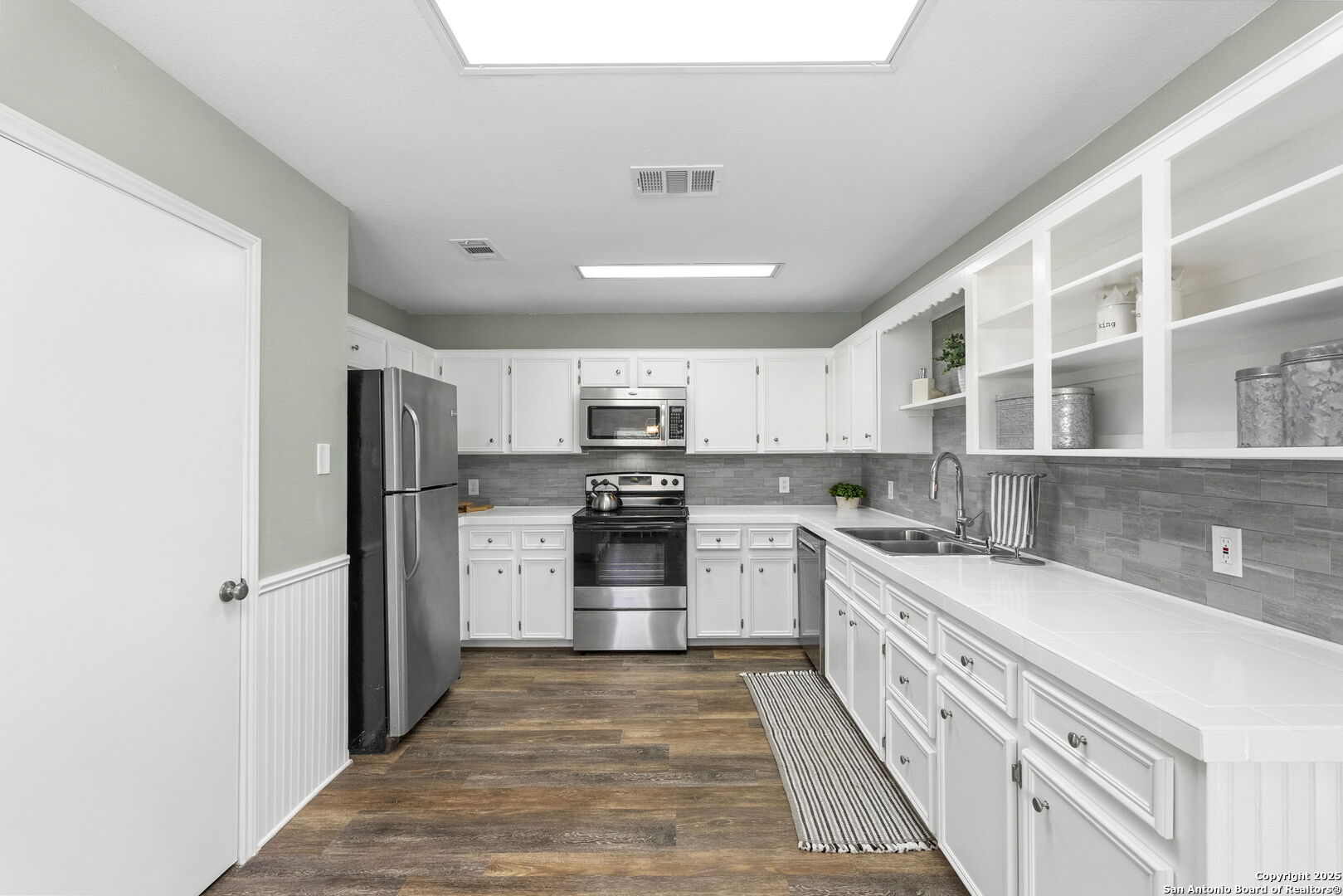 668 Indian Mound Road Tarpley, TX 78883 - Photo 26 of 50 a kitchen with stainless steel appliances granite countertop a refrigerator and a sink