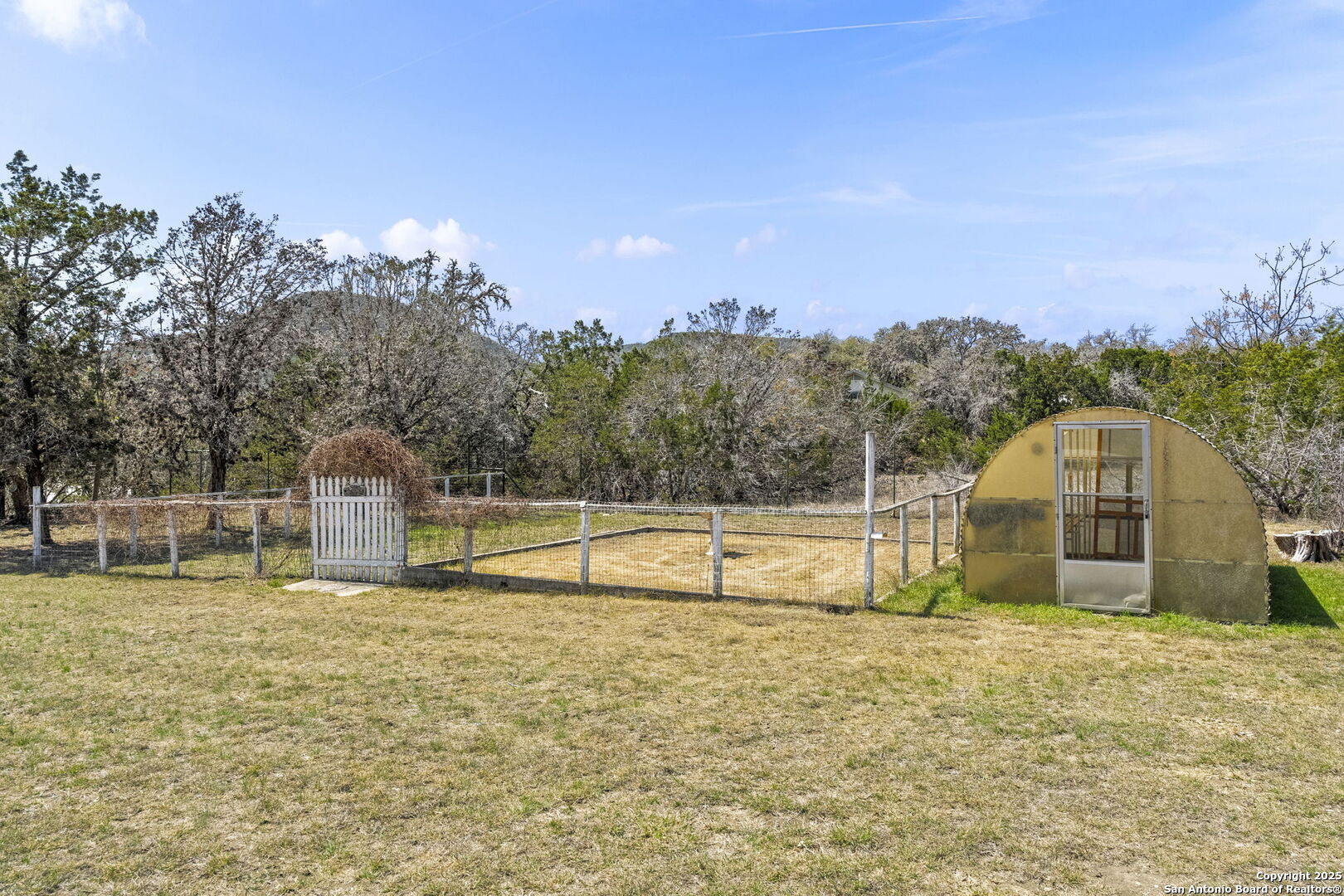 668 Indian Mound Road Tarpley, TX 78883 - Photo 43 of 50 a view of a swimming pool with a yard