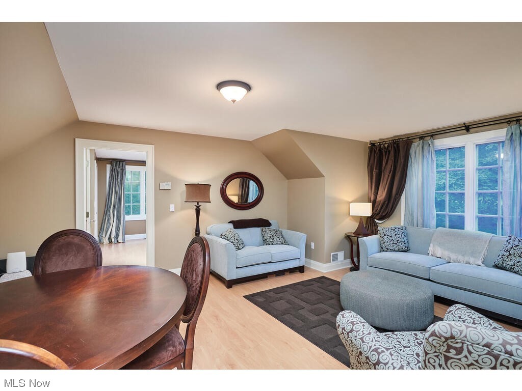 554 Merriman Road Akron, OH 44303 - Photo 27 of 35 Living room featuring light hardwood floors and lofted ceiling