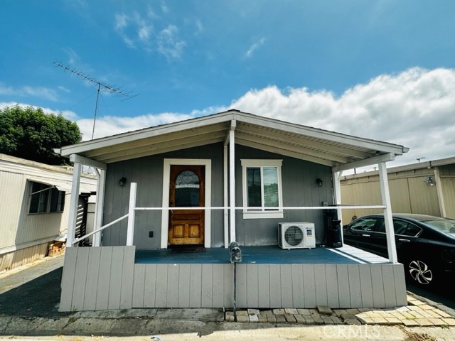 a view of a house with a wooden fence