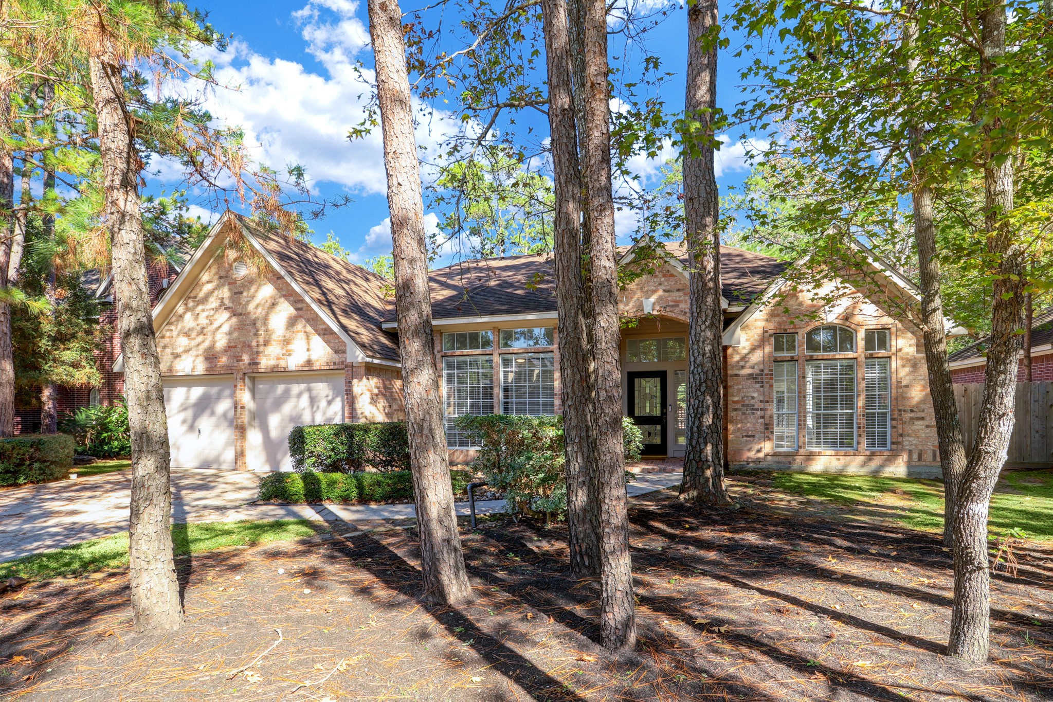 138 Summer Storm Place Spring, TX 77381 - Photo 1 of 20 Charming one-story brick home set beneath mature trees on a quiet cul-de-sac in The Woodlands’ Village of Cochran’s Crossing.