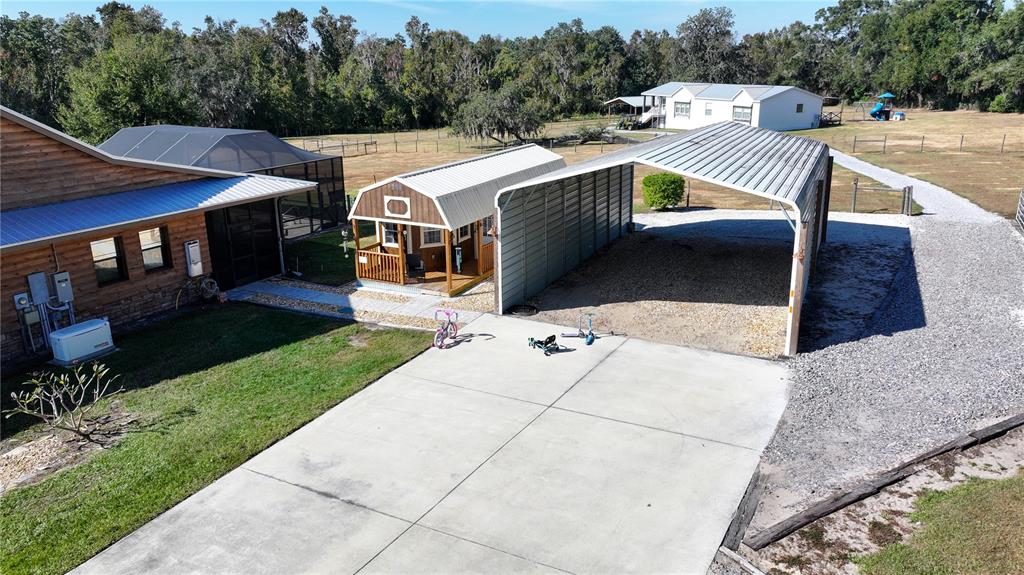 3182 Indian Ridge Place Lakeland, FL 33810 - Photo 13 of 45 a view of a house with pool and chairs