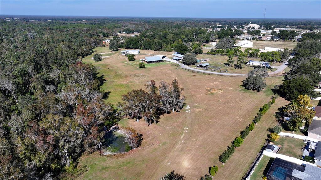 3182 Indian Ridge Place Lakeland, FL 33810 - Photo 19 of 45 a view of a terrace with a garden and chair