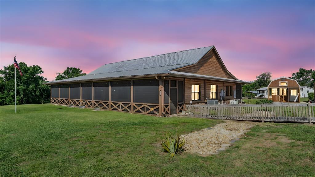 3182 Indian Ridge Place Lakeland, FL 33810 - Photo 20 of 45 a front view of a house with a yard