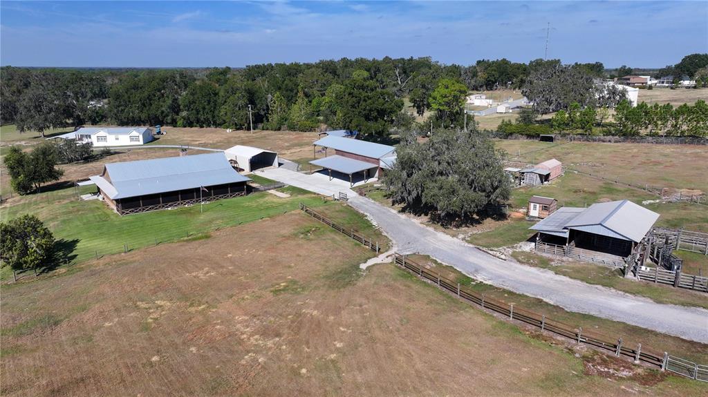 3182 Indian Ridge Place Lakeland, FL 33810 - Photo 2 of 45 an aerial view of a house with a yard and lake view