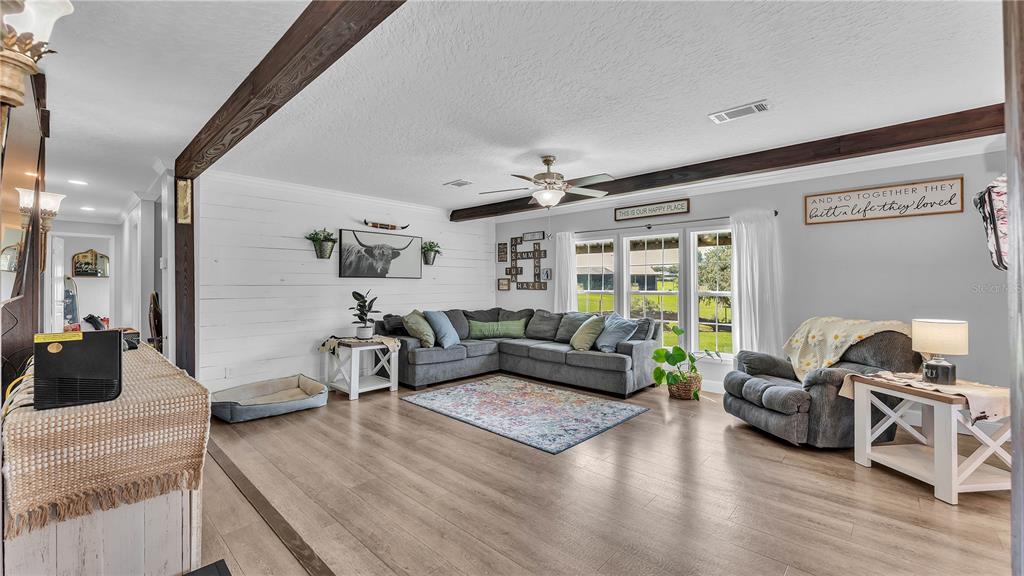 3182 Indian Ridge Place Lakeland, FL 33810 - Photo 21 of 45 a living room with furniture and wooden floor