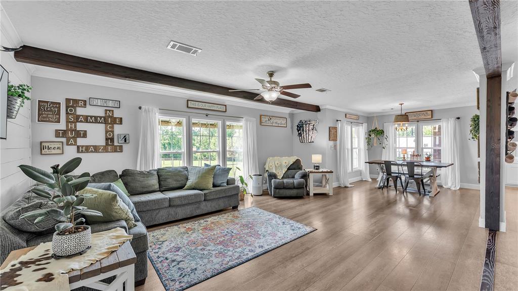 3182 Indian Ridge Place Lakeland, FL 33810 - Photo 24 of 45 a living room with furniture and wooden floor