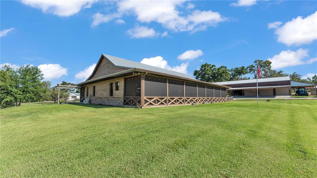 3182 Indian Ridge Place Lakeland, FL 33810 - Photo 27 of 45 a front view of a house with a garden