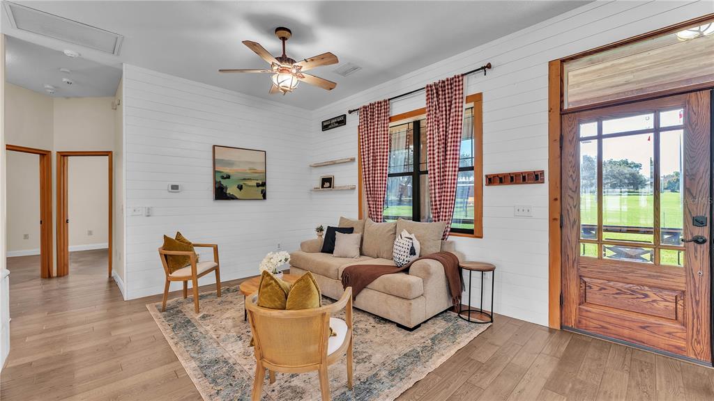 3182 Indian Ridge Place Lakeland, FL 33810 - Photo 29 of 45 a living room with furniture and wooden floor