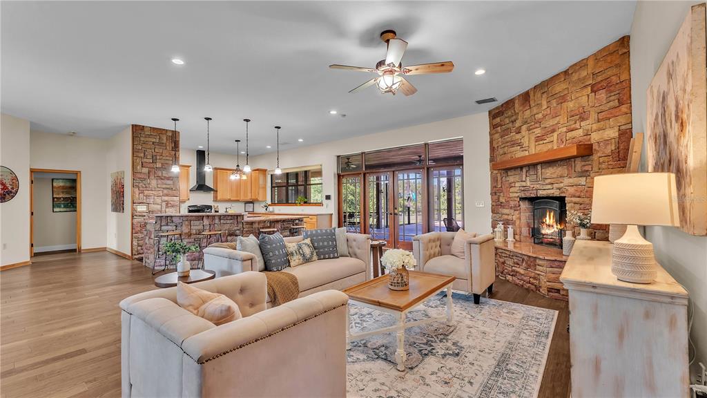 3182 Indian Ridge Place Lakeland, FL 33810 - Photo 31 of 45 a living room with furniture and a fireplace