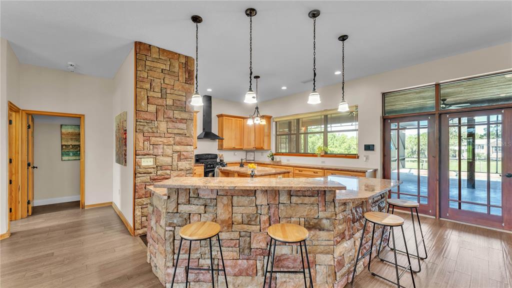 3182 Indian Ridge Place Lakeland, FL 33810 - Photo 33 of 45 a view of a dining room with furniture wooden floor and chandelier