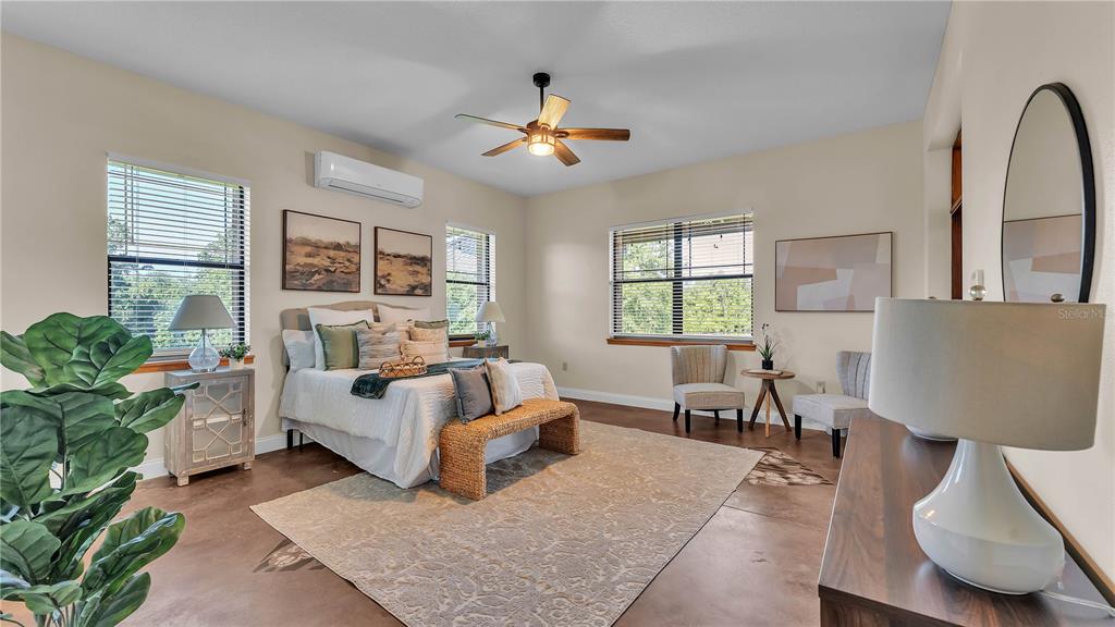 3182 Indian Ridge Place Lakeland, FL 33810 - Photo 35 of 45 a living room with furniture and a large window