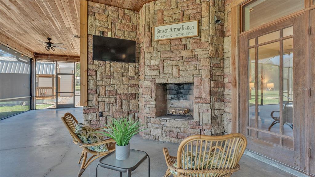 3182 Indian Ridge Place Lakeland, FL 33810 - Photo 41 of 45 a living room with furniture and a flat screen tv