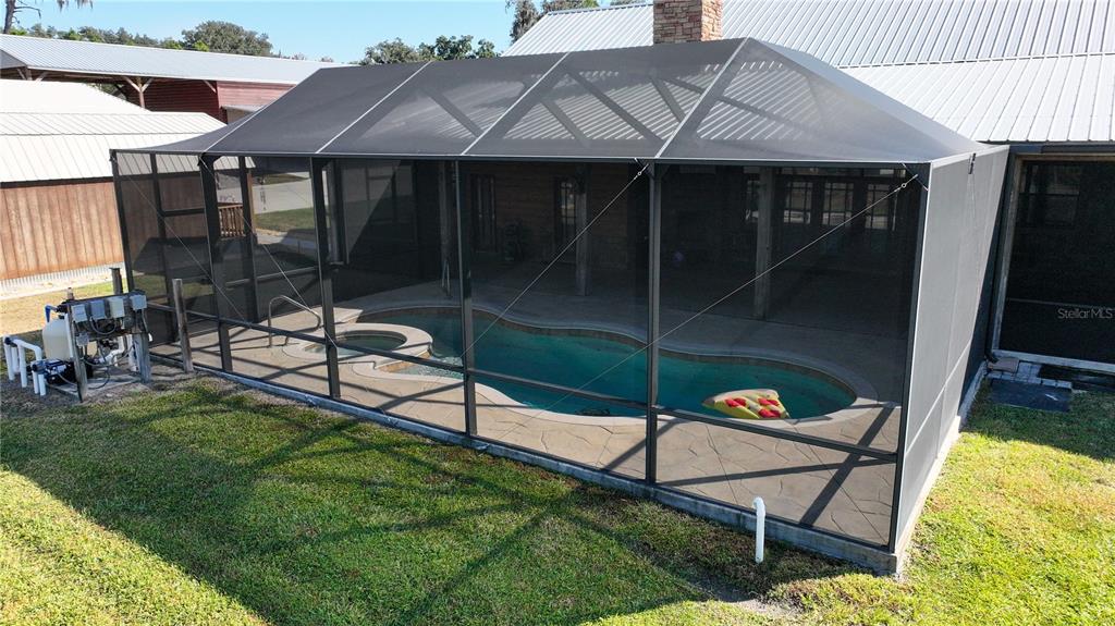 3182 Indian Ridge Place Lakeland, FL 33810 - Photo 9 of 45 a backyard of a house with table and chairs