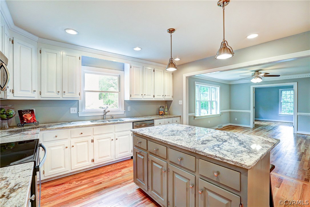 13231 Drakewood Road Midlothian, VA 23113 - Photo 13 of 31 a kitchen that has a lot of cabinets in it and wooden floor