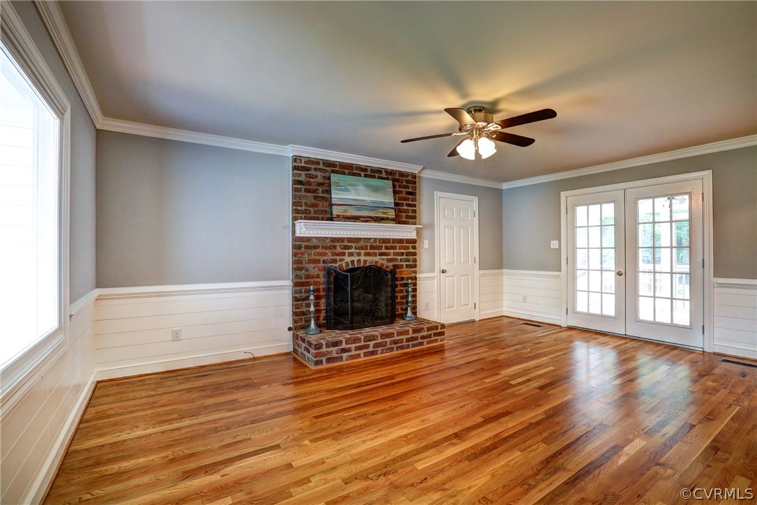 13231 Drakewood Road Midlothian, VA 23113 - Photo 6 of 31 a view of an empty room with window and wooden floor