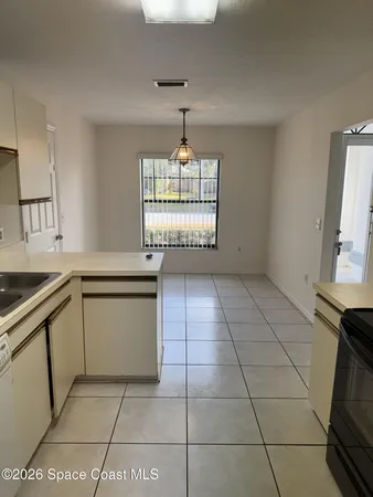 a kitchen with a stove top oven cabinets and stainless steel appliances