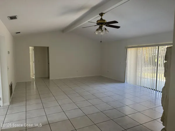 a view of an empty room and window