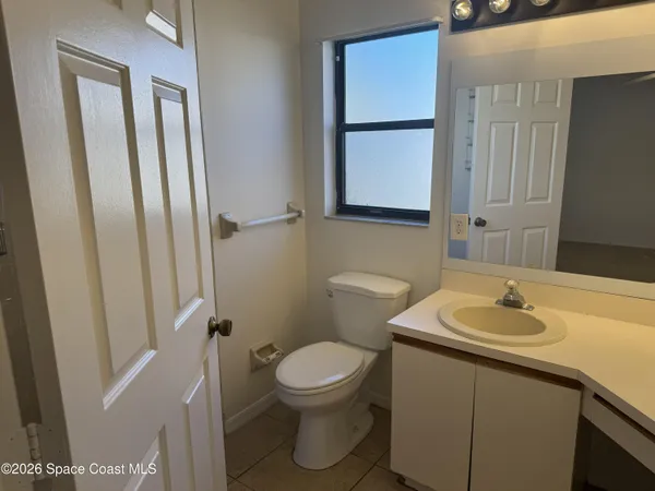 a bathroom with a sink toilet and vanity