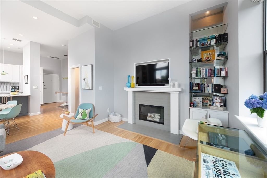 130 Appleton Street, Unit 4D Boston, MA 02116 - Photo 11 of 34 a living room with furniture and a fireplace