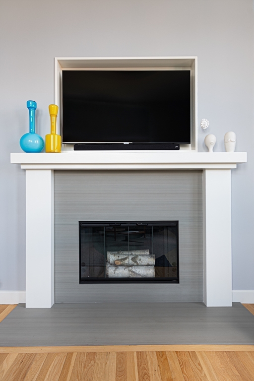 130 Appleton Street, Unit 4D Boston, MA 02116 - Photo 13 of 34 a living room with a fireplace and a flat screen tv