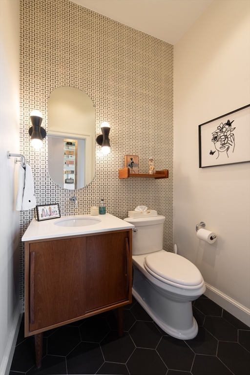 130 Appleton Street, Unit 4D Boston, MA 02116 - Photo 16 of 34 a bathroom with a sink mirror vanity and toilet