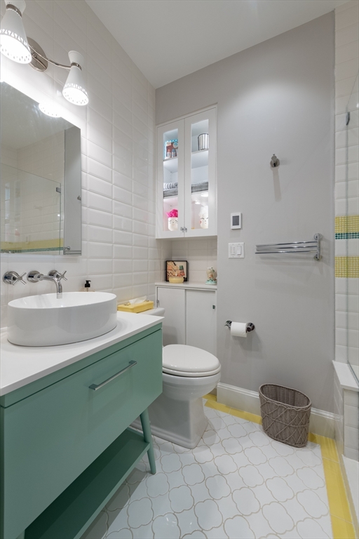 130 Appleton Street, Unit 4D Boston, MA 02116 - Photo 22 of 34 a bathroom with a sink mirror vanity and toilet