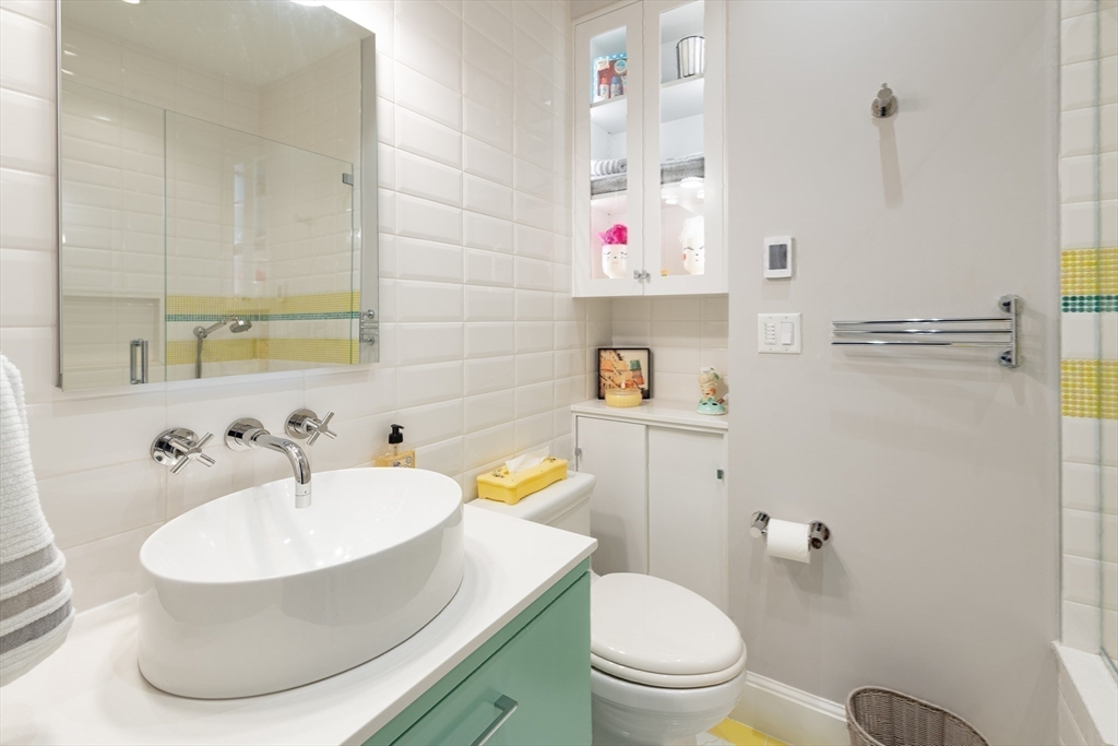 130 Appleton Street, Unit 4D Boston, MA 02116 - Photo 23 of 34 a bathroom with a sink toilet and a mirror