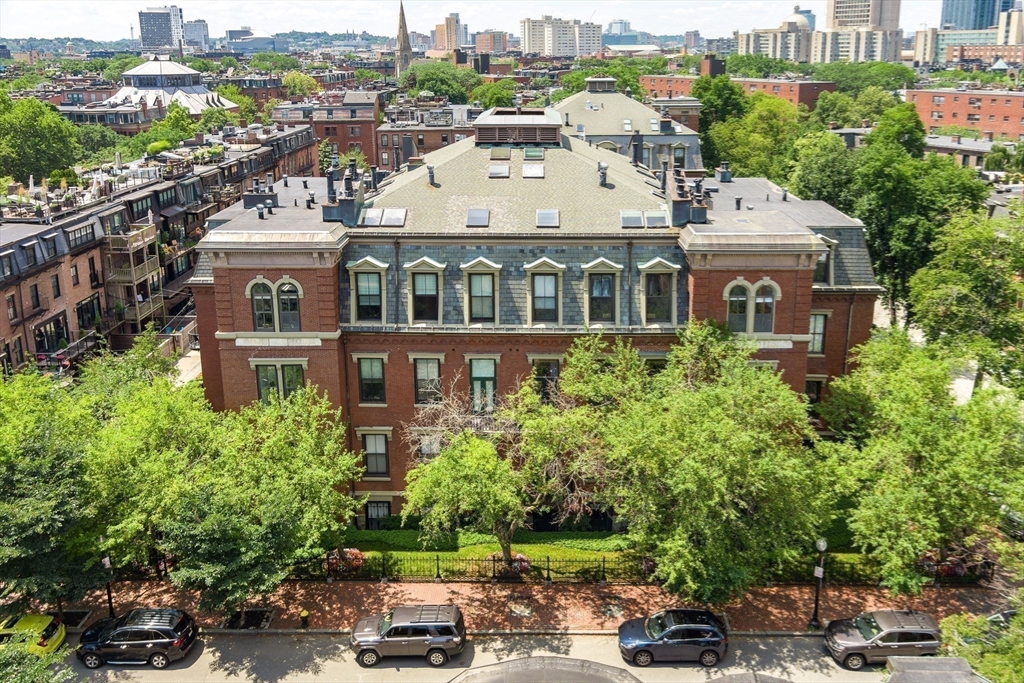 130 Appleton Street, Unit 4D Boston, MA 02116 - Photo 28 of 34 a view of a white building among the street with plants