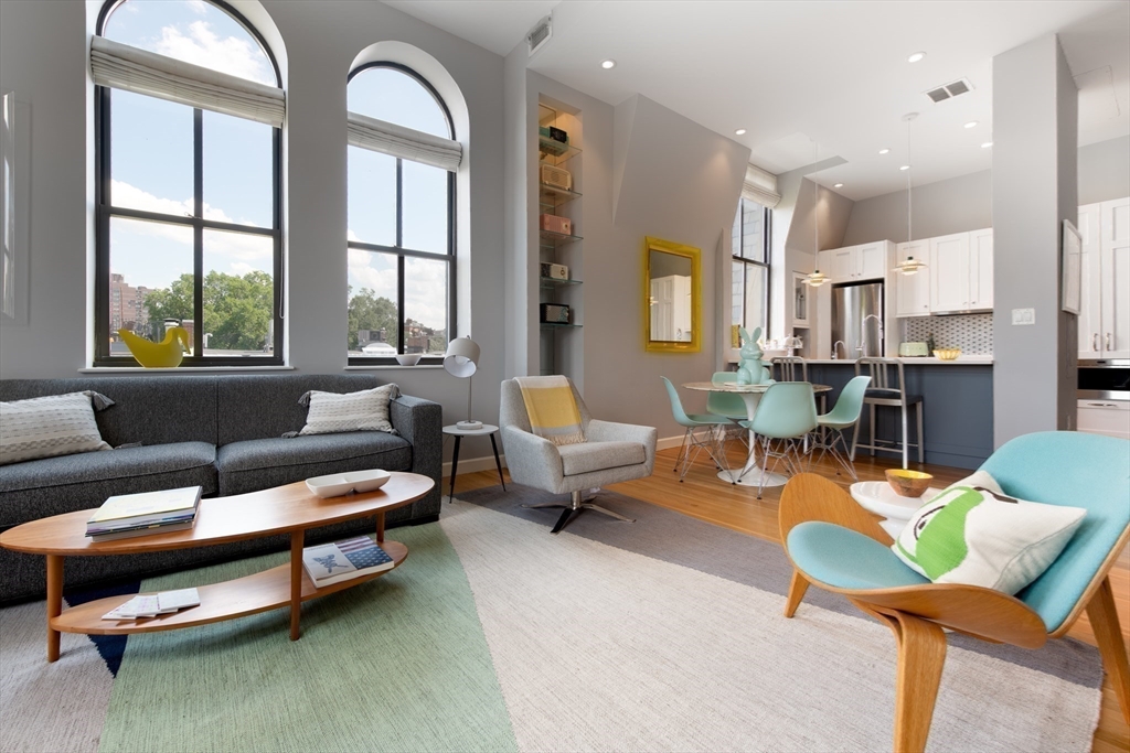 130 Appleton Street, Unit 4D Boston, MA 02116 - Photo 10 of 34 a living room with furniture and a large window