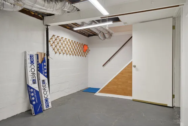 a bathroom with a double vanity sink a mirror and a bathtub