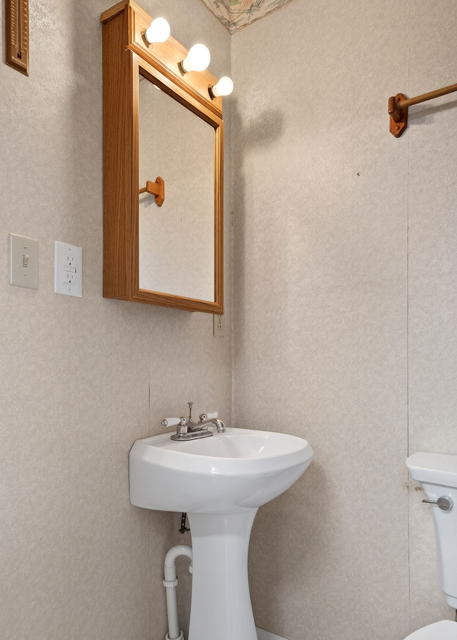 850 Wesley Chapel Road Sparta, TN 38583 - Photo 13 of 68 a bathroom with a sink and mirror