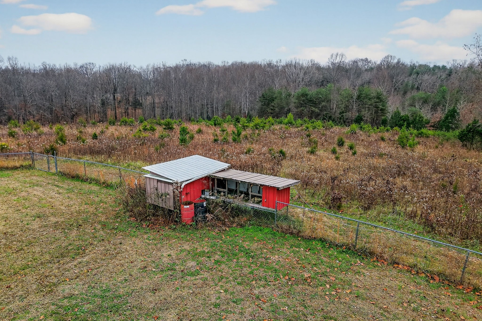 850 Wesley Chapel Road Sparta, TN 38583 - Photo 36 of 68 a aerial view of a house with a yard and tree in the background