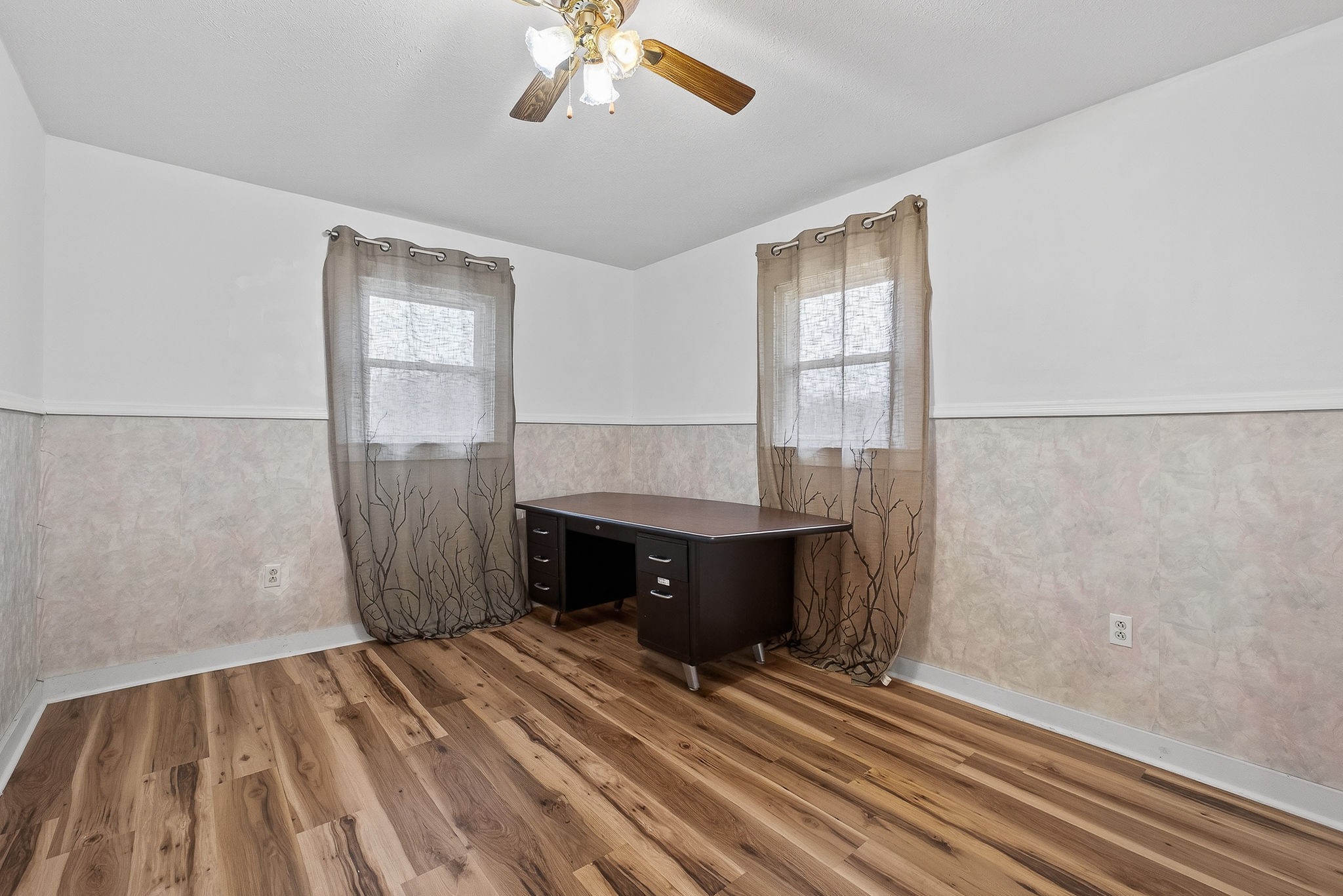 850 Wesley Chapel Road Sparta, TN 38583 - Photo 63 of 68 a view of an empty room with chandelier fan and wooden floor