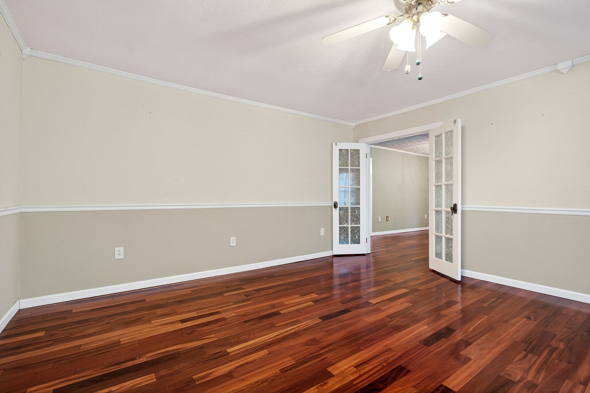 850 Wesley Chapel Road Sparta, TN 38583 - Photo 66 of 68 an empty room with wooden floor chandelier fan and windows