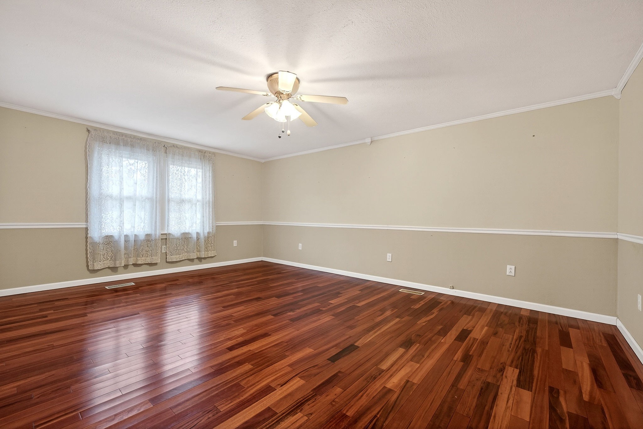 850 Wesley Chapel Road Sparta, TN 38583 - Photo 7 of 68 an empty room with wooden floor and windows