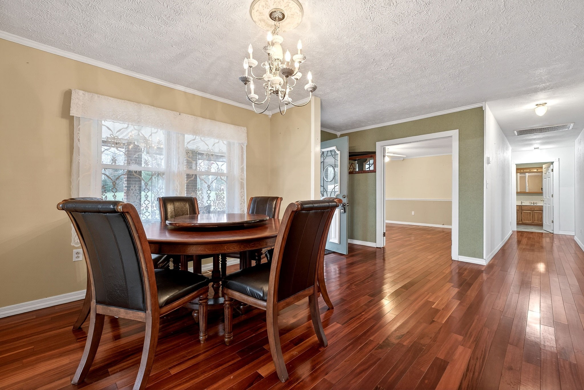 850 Wesley Chapel Road Sparta, TN 38583 - Photo 8 of 68 a view of a dining room with furniture a chandelier and wooden floor