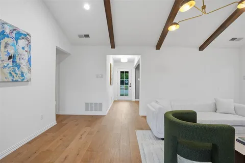 a view of livingroom with furniture and wooden floor