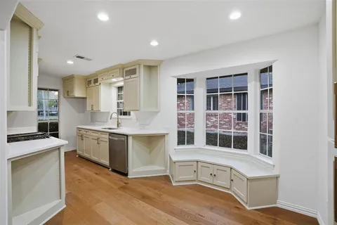 a kitchen with stainless steel appliances granite countertop a stove and a sink