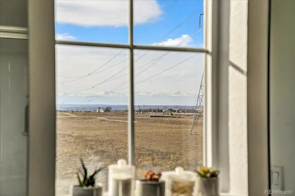 a view of a glass door with a view of sitting area