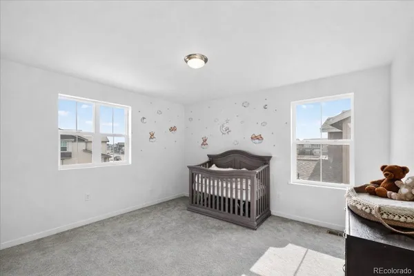 a view of a livingroom with a window and deck