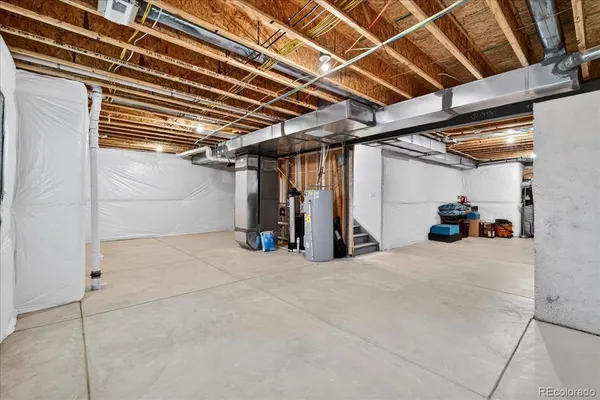 a view of empty room with wooden ceiling