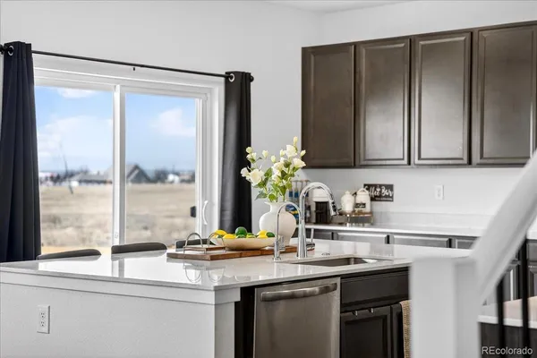 a kitchen with a sink and a window