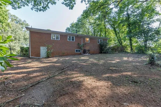 a view of a outdoor space with large trees