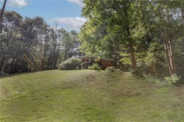 a view of a field with an trees