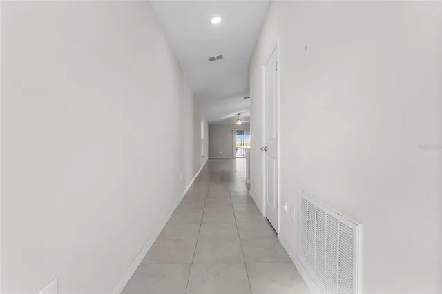 a view of a hallway with a white walls
