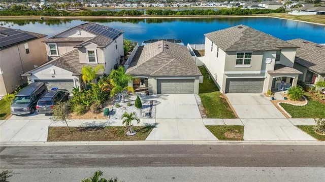 an aerial view of a house with a ocean view