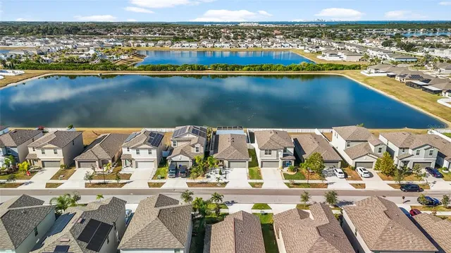 an aerial view of residential houses with outdoor space