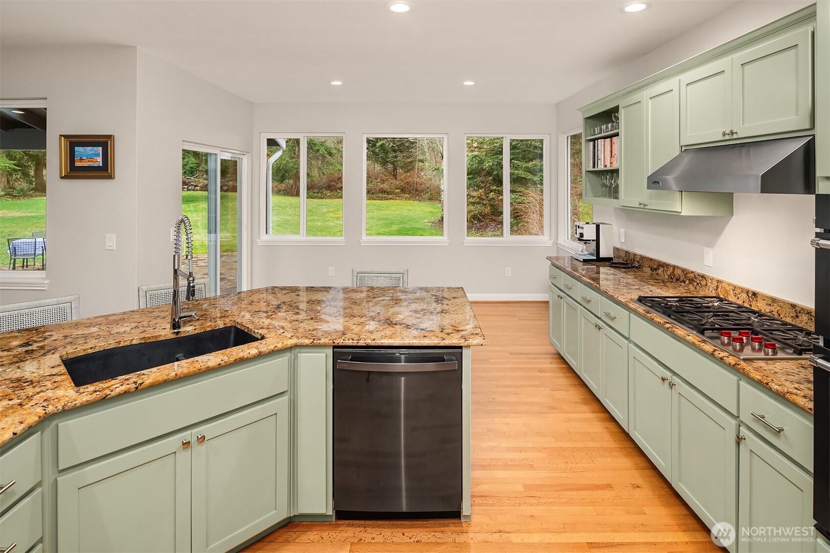 47419 Southeast 157th Place North Bend, WA 98045 - Photo 18 of 39 a kitchen with stainless steel appliances granite countertop a stove and a sink