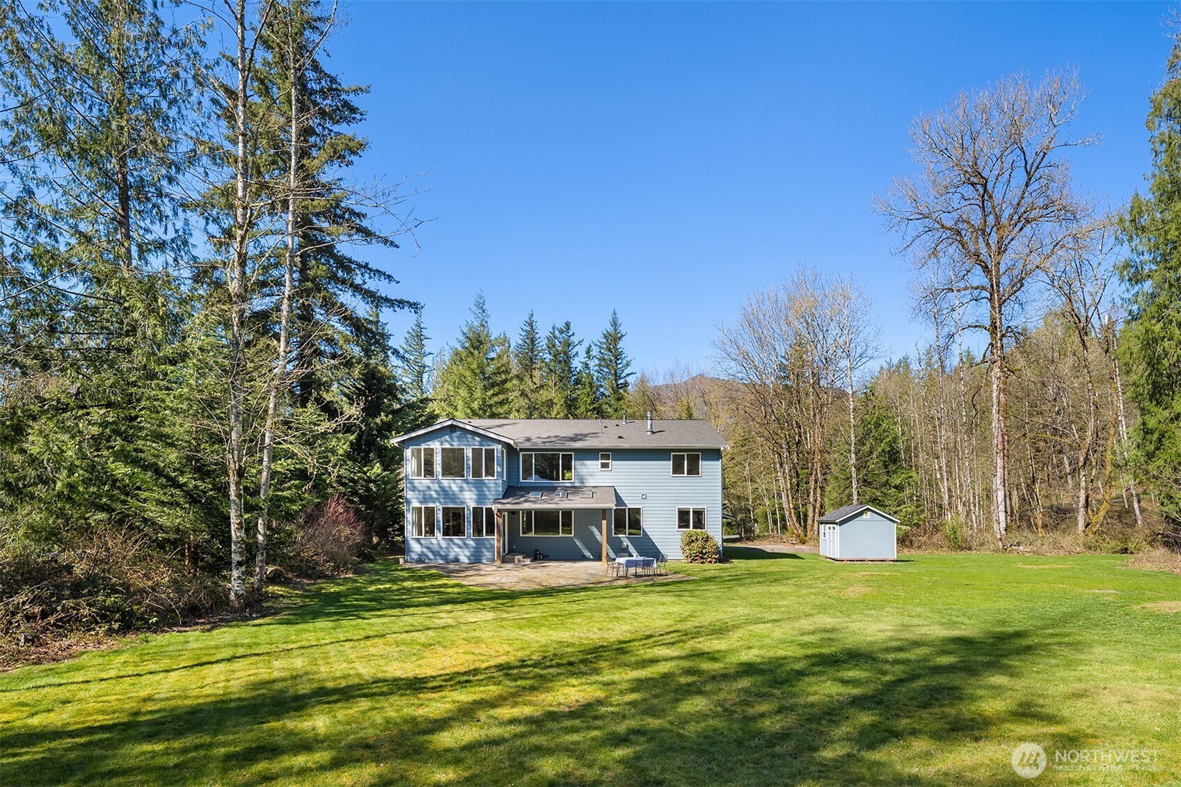47419 Southeast 157th Place North Bend, WA 98045 - Photo 23 of 39 a view of a house with a big yard and palm trees